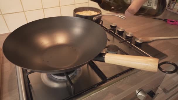 Pouring Olive Oil Iron Wok Burner Stove High Angle — Stock Video