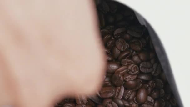Barista Scoops Teaspoon Roasted Coffee Beans Pack Close Overhead — Wideo stockowe