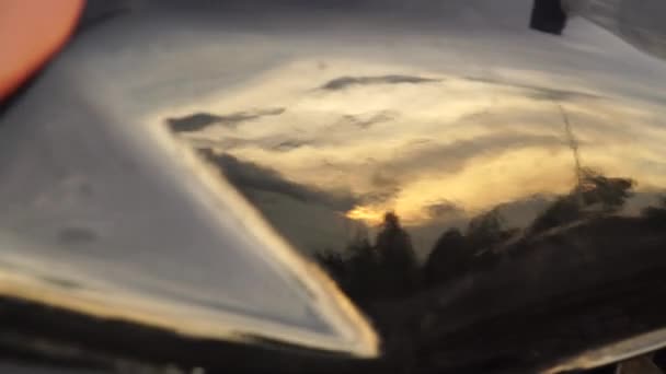 Close Slider Shot Motorcycle Tank Reflecting Sunset — Vídeo de Stock
