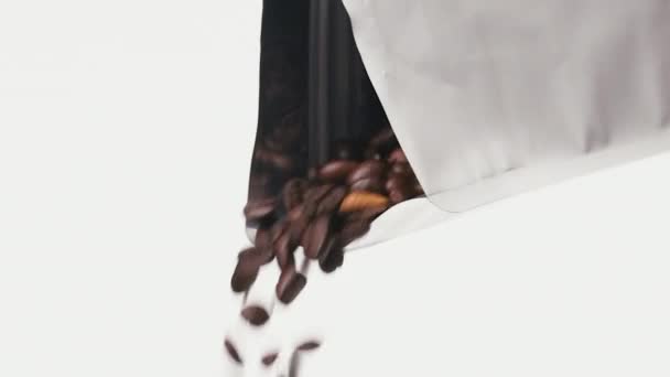 Roasted Coffee Beans Falling Metallic Noname Coffee Bag Front White — Stockvideo