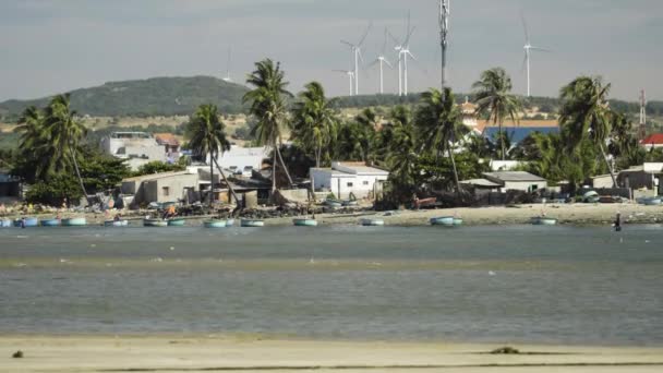 Poor Coastal Homes Vietnamese People Expensive Modern Wind Turbines Background — Vídeo de Stock