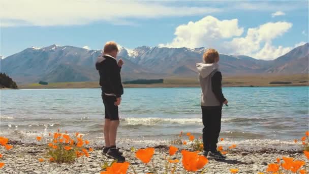 Boys Skimming Stones Lake Tekapo New Zealand Handheld Steady Shot — Stock videók