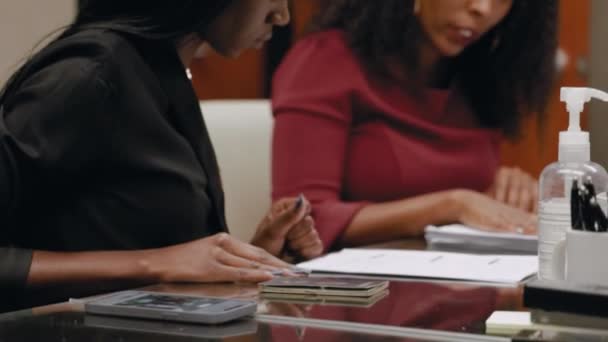 Close Shot Two Black Women Sitting Table Reading Documents Having — Stockvideo