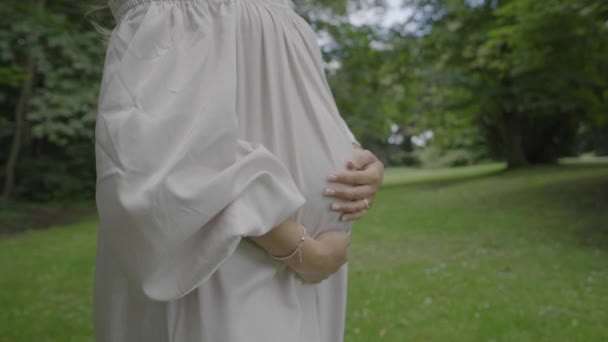 Closeup Shot Pregnant Young Woman Wearing Beautiful White Dress Holding — Wideo stockowe