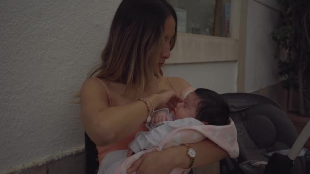 Beautiful Young Mother Holding Her Adorable Little Baby Stroking Baby — Vídeos de Stock