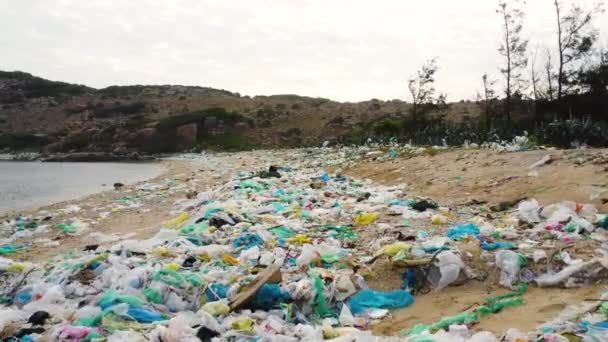 Aerial Dolly Left Shot Plastic Rubbish Beach Sand Vietnam — 图库视频影像