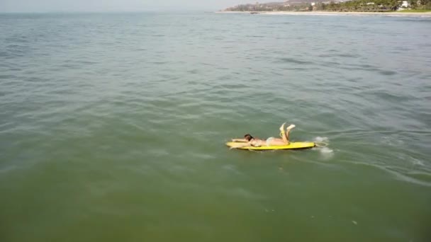 Caucasian Young Sexy Surfer Bikini Paddling Yellow Surf Board Open — Stockvideo