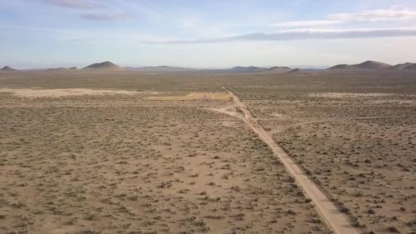 Lonely Person Stands All Alone Deserted Road Desert Smooth Aerial — Stockvideo