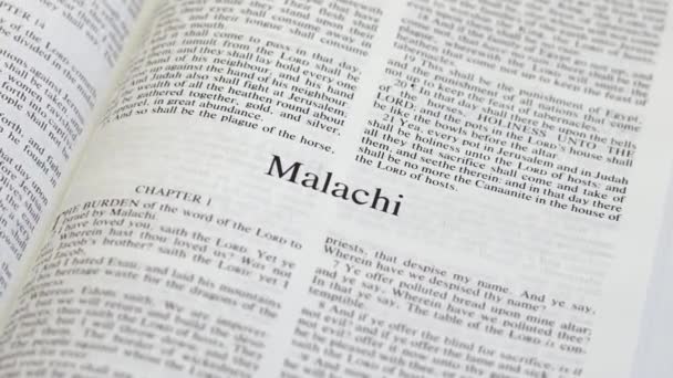 Close Shot Bible Page Turning Book Malachi — Stockvideo