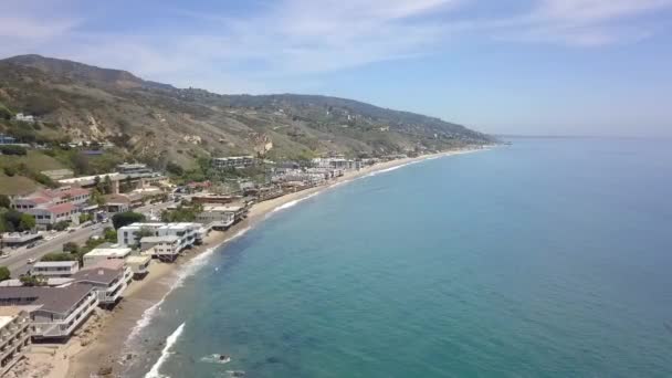 Slow motion Malibu Beach House on Highway One.Beautiful aerial view flight panorama overview drone footagein LA at Malibu Pier Beach USA 2018. Cinematic Travel guide from above by Philipp Marnitz