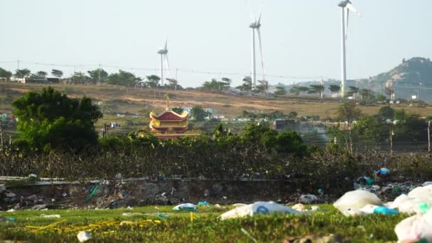 Scattered Plastic Debris Son Hai Vietnam Windmill Structures Background Static — Vídeos de Stock