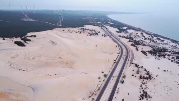 Aerial Scenic White Sand Dunes Landscape Asia Coastline Wind Turbine — Stockvideo