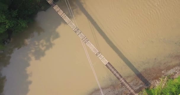 Aerial Headshot Suspension Bridge River Motorcycle Crossing Foggy Morning Sun — Stockvideo