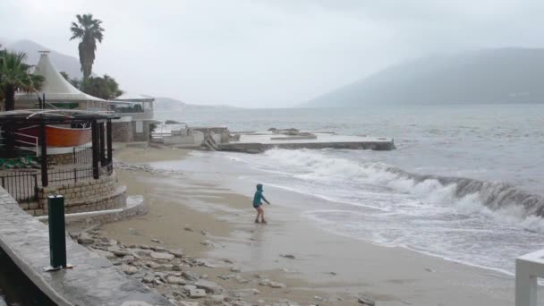Distant Shot Person Running Away Sea Waves Slow Motion Rainy — Stockvideo