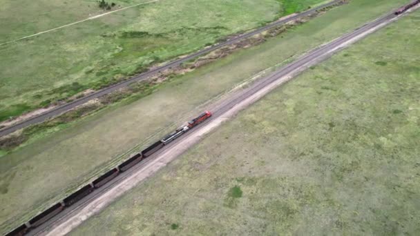 Aerial Parallax Directly Coal Train Traveling Remote Grassland — Video