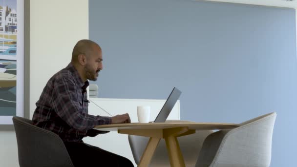 Bald Asian Male Working Remote Office Laptop Drinking White Mug — Stockvideo