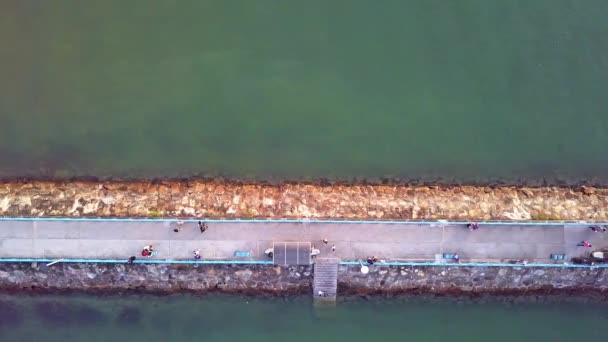 Dynamic Top Aerial Shot Breakwater Jetty Made Out Stones Paved — Vídeos de Stock