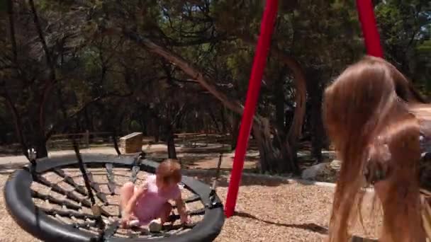 Mother Pushing Daughter Swing Playground Toddler Having Fun Playing Sunny — Video Stock