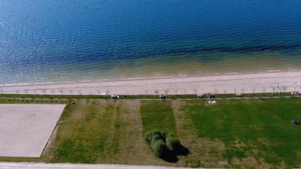 Lake Beach People Sunbathing Bathing Garden Walking Area Overhead Drone — Stockvideo