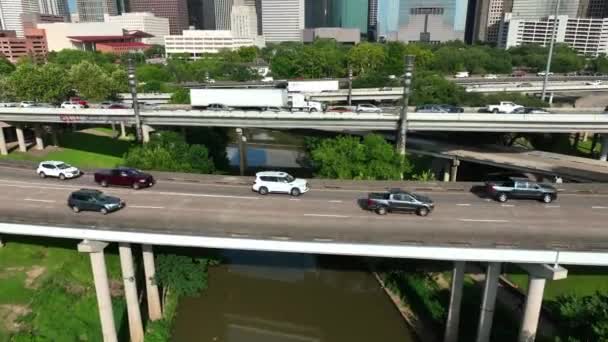 Aerial Reveal Downtown Houston Texas Skyline Traffic Rushes Interstate Freeway — Stock video