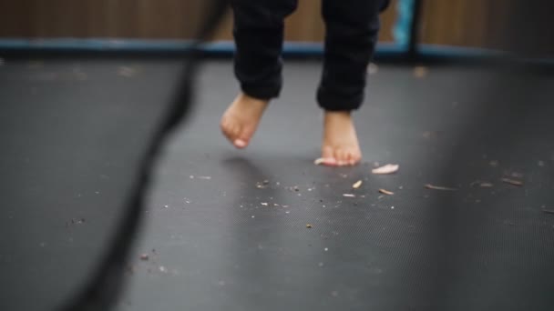 Small Boys Bare Feet Jumping Super Slow Motion Trampoline Rack — Stock Video