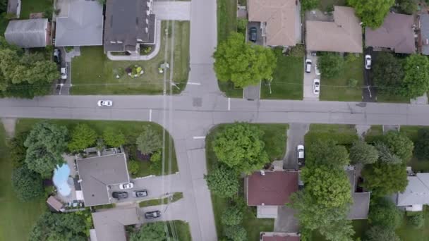 Top View White Car Driving Suburban Neighborhood Aerial Drone View — ストック動画