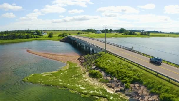 Aerial View Follows Vehicle Bridge Prince Edward Island Summer Day — Vídeos de Stock