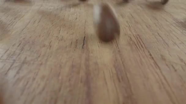 Many Coffee Beans Dropped Wooden Table Falling Big Container Epic — 비디오