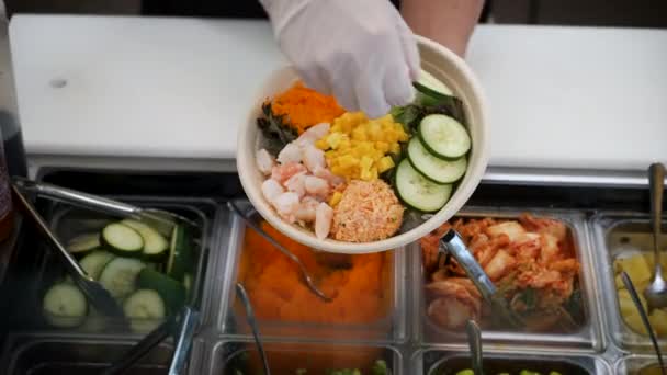 Top View Worker Building Traditional Sushi Salad Adding Cucumber Poke — Stock video