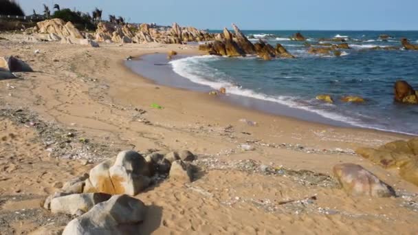 Sandy Beach Littered Trash Washed Sea Vietnam Sideways Drone Shot — Wideo stockowe