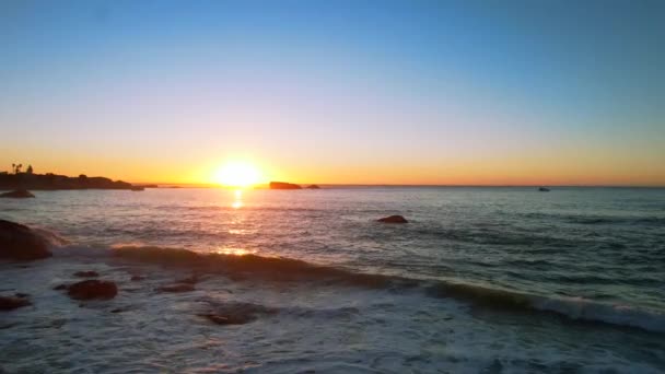 Person Beach Shoreline Looking Vibrant Sunset Horizon Aerial — Video