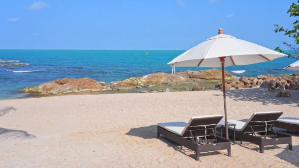 Two Deckchairs Parasol Tropical Beach Rocky Beach Sea — Stockvideo