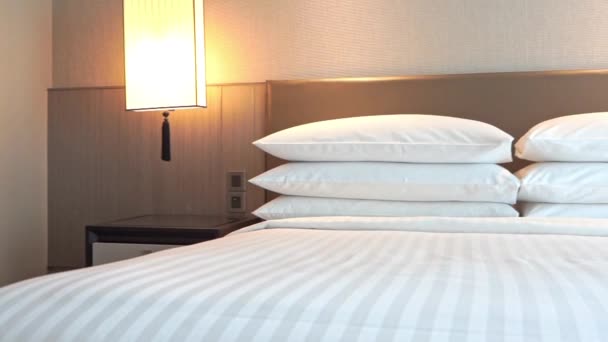 Hotel Room Bedding Bed Pillows Turned Night Lights Pan Right — Stockvideo