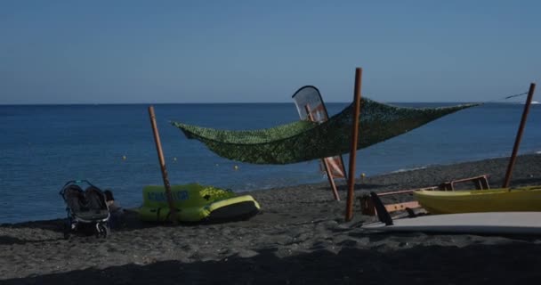 Watersport Items Sitting Beach People Walk Volcanic Black Sand Beach — Vídeos de Stock