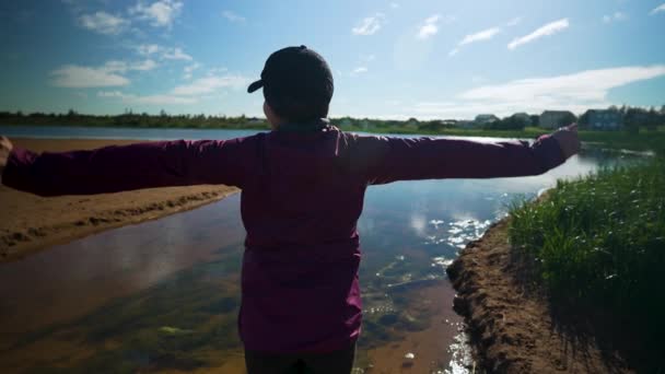 Woman Short Hair Cap Stretches Her Arms Wide While Overlooking — Stock video