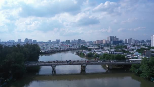 Aerial Tracking Shot Urban Traffic Bridge High Density Waterfront Housing — Vídeo de Stock