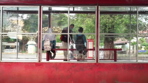 Students Sit Long Chairs Bus Transit Brt Stop Pass Cleaning — стокове відео