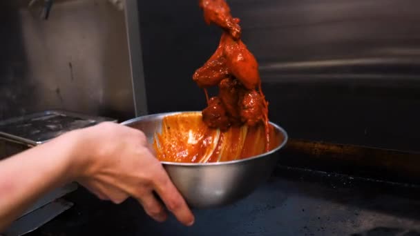 Chef Tosses Fried Chicken Wings Vibrant Orange Buffalo Sauce Slow — Αρχείο Βίντεο
