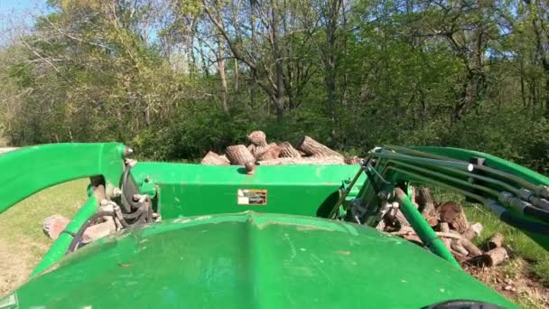 Pov While Operating Green Tractor Hydraulic Forks Move Cut Logs — Stock video