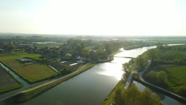Aerial View Sunset River Revealing Houseboat Passing Village Left Side — 图库视频影像