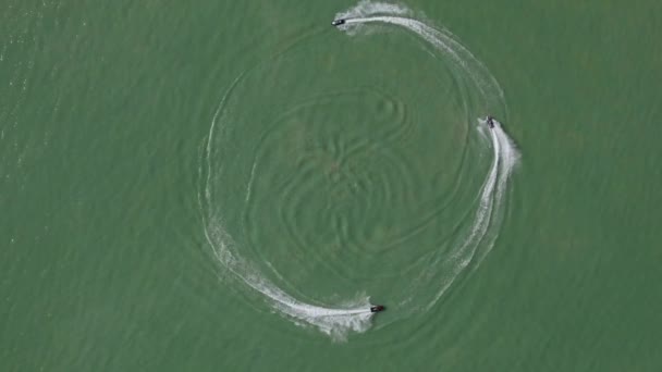 Three Jet Skis Riding Circle Lake Aerial Top View Slomo — Vídeo de stock