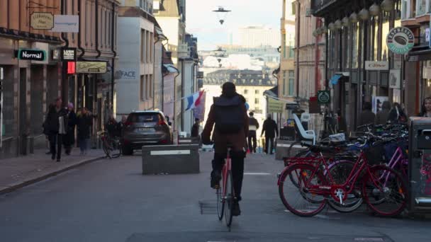 People Ride Bikes Scooters Walk Street Stockholm Sweden — стоковое видео