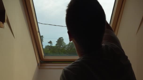 Man Opening Loft Roof Window Slow Motion Green Field Trees — Αρχείο Βίντεο