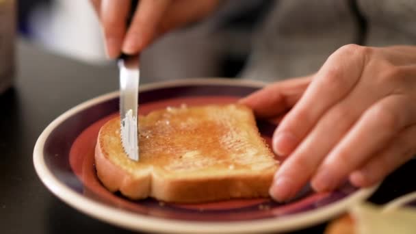 Spreading Butter Kitchen Knife Toast Sliced Bread Plate Close Shot — Video Stock