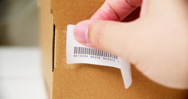 Hands Applying Recycle Sticker Label Cardboard Box Barcode Rethink Reuse — Vídeo de Stock