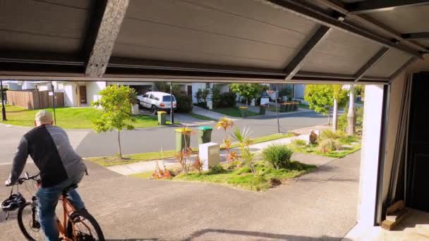 Garage Door Goes Man Rides His Bike Driveway Suburban Footpath — Video