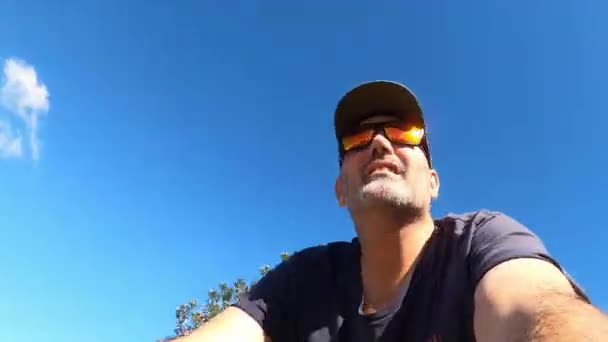 Directly Man Wearing Baseball Cap Sunglasses Riding Pushbike — Stockvideo