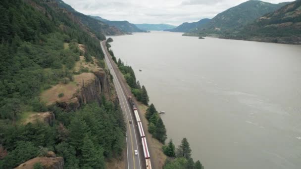 Aerial Rise Train Highway Traffic Traveling Next Columbia River — Stock videók