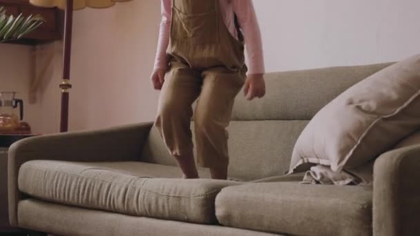 Young Girl Jumping Sofa Jumps Away Children Playground Moment — Vídeos de Stock