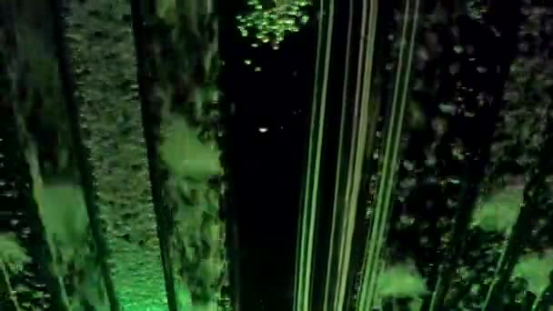 Glowing Green Bubbles Travel Fast Glass Tube Dark — ストック動画